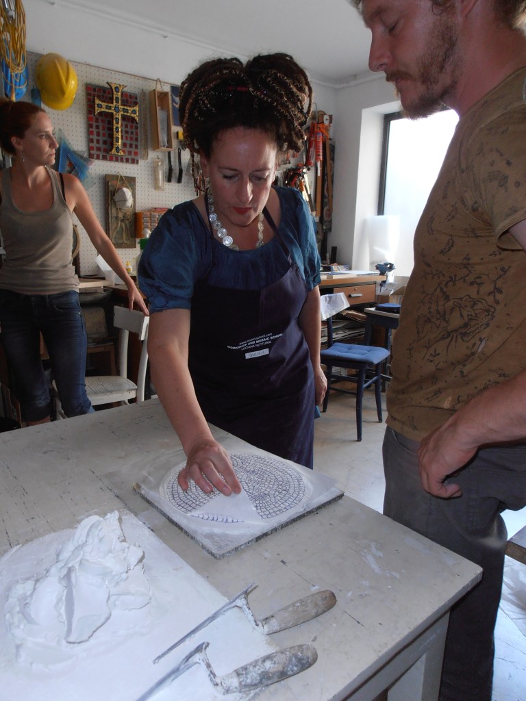Sarah-Alice Miles at work in Ravenna- making mosaics the ancient way.